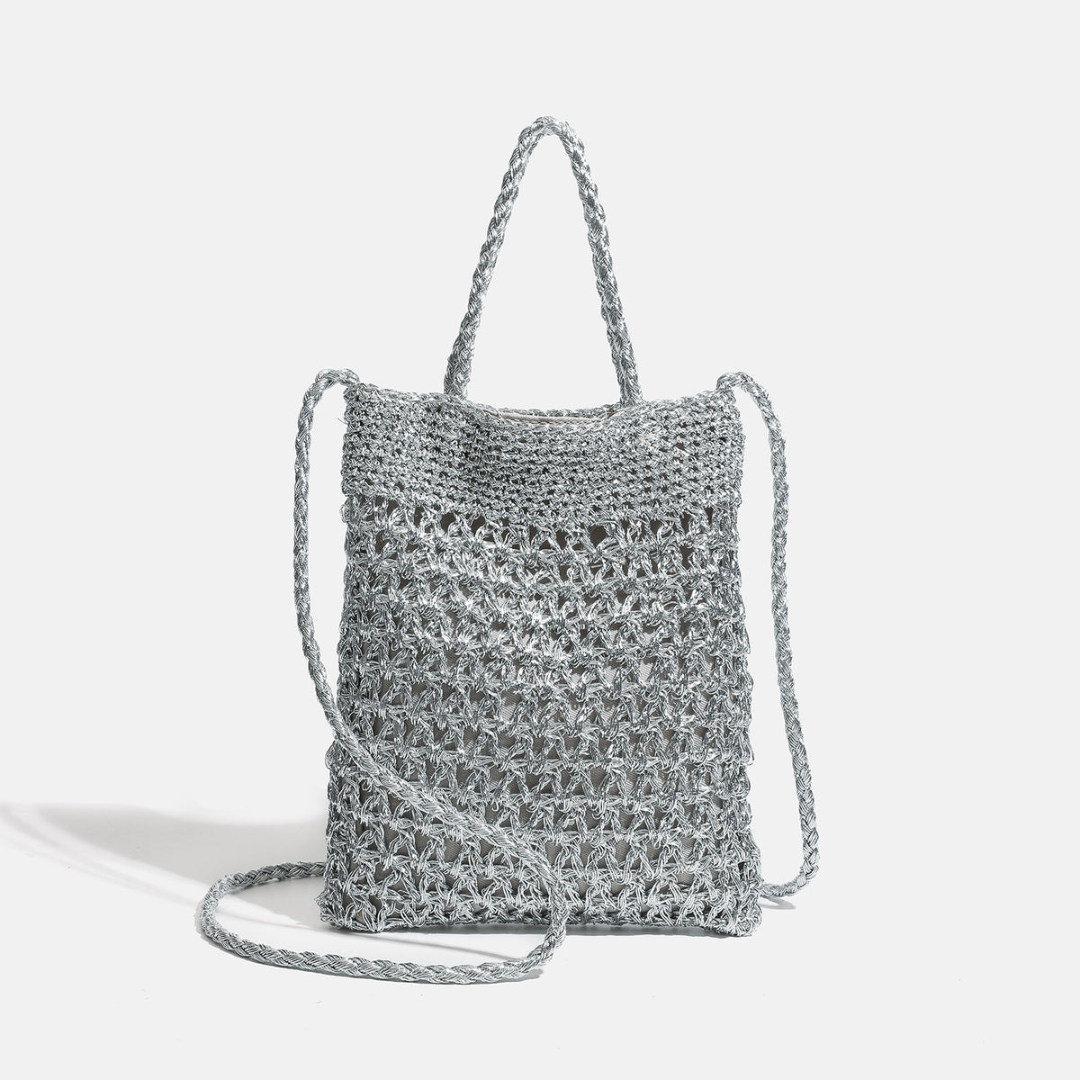 Small soft rectangular metallic crochet-weave shoulder bag with braided top handle and long crossbody strap, detail view 7