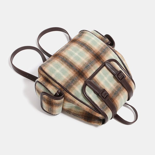 Compact vintage plaid backpack in khaki and sage check with dark leather-look trim, buckle flap closure, and adjustable