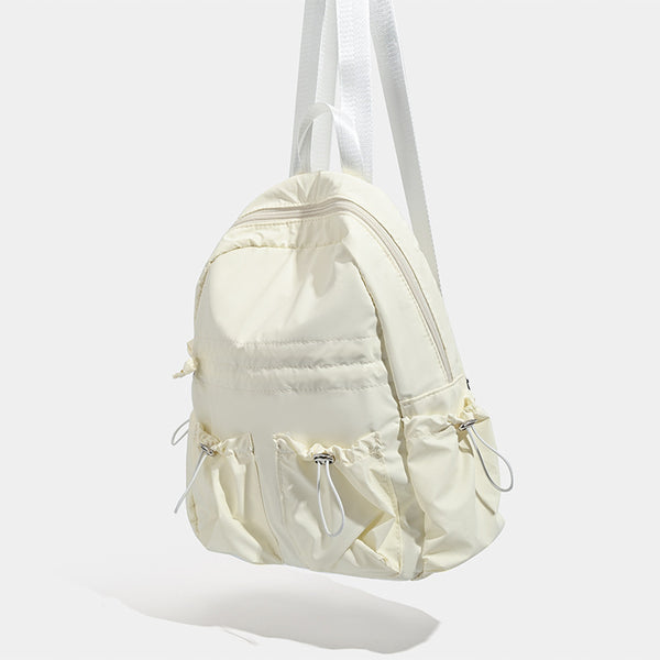 Puffy matte nylon mini backpack with drawcord gathered front pockets and silver-tone hardware, detail view 3
