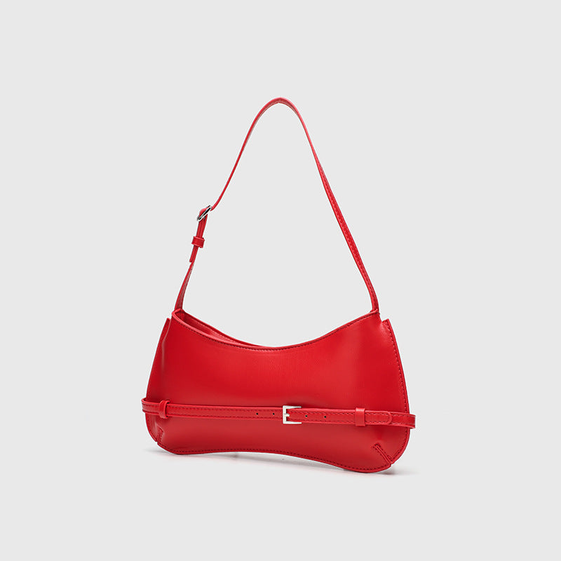 Curved baguette shoulder bag with front buckle strap and adjustable thin strap in glossy leather-look finish, detail view 4