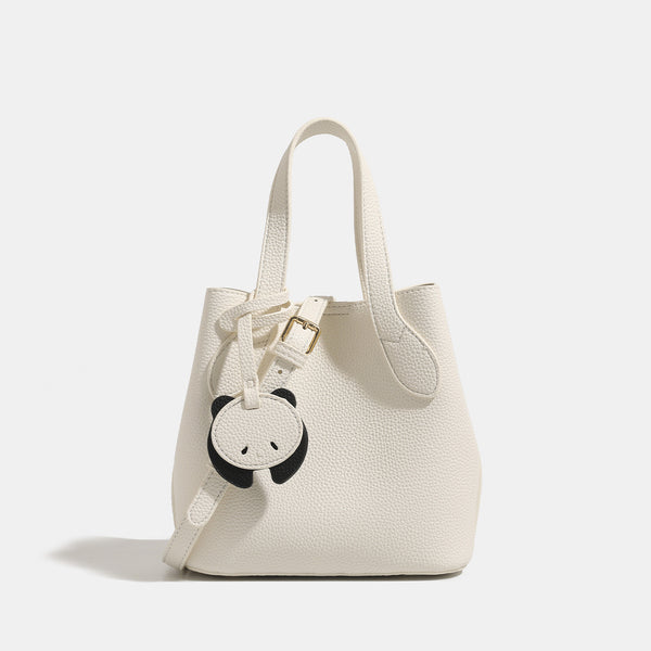 Pebbled leather-look bucket tote with elephant charm pendant, dual top handles, and detachable shoulder strap, detail view 7