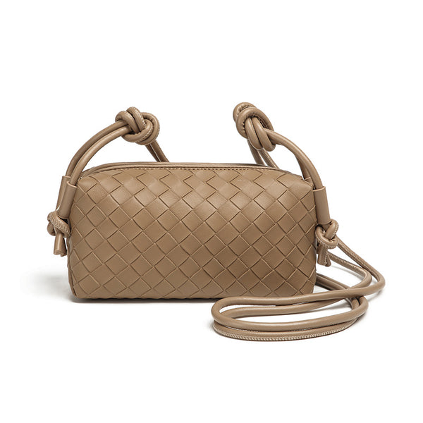 Small rectangular woven-texture mini crossbody bag with knotted rope strap and gold-tone zip closure, detail view 9
