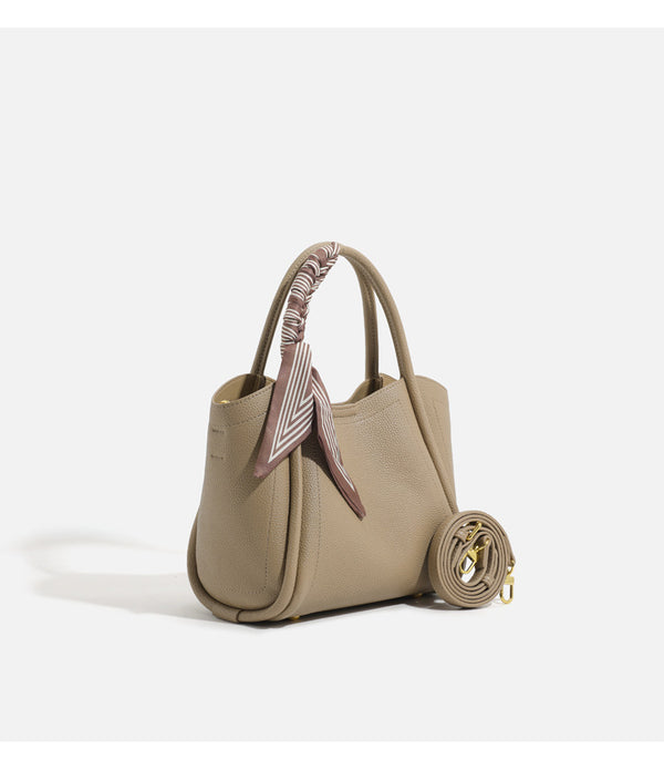 Pebbled leather-look bucket tote bag with scarf-wrapped top handle and gold-tone hardware, detail view 15
