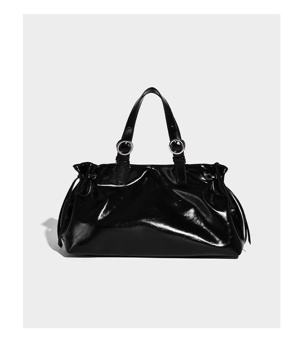 Glossy patent-look slouchy tote bag with ruched drawstring sides, dual top handles, silver ring hardware, and detachable