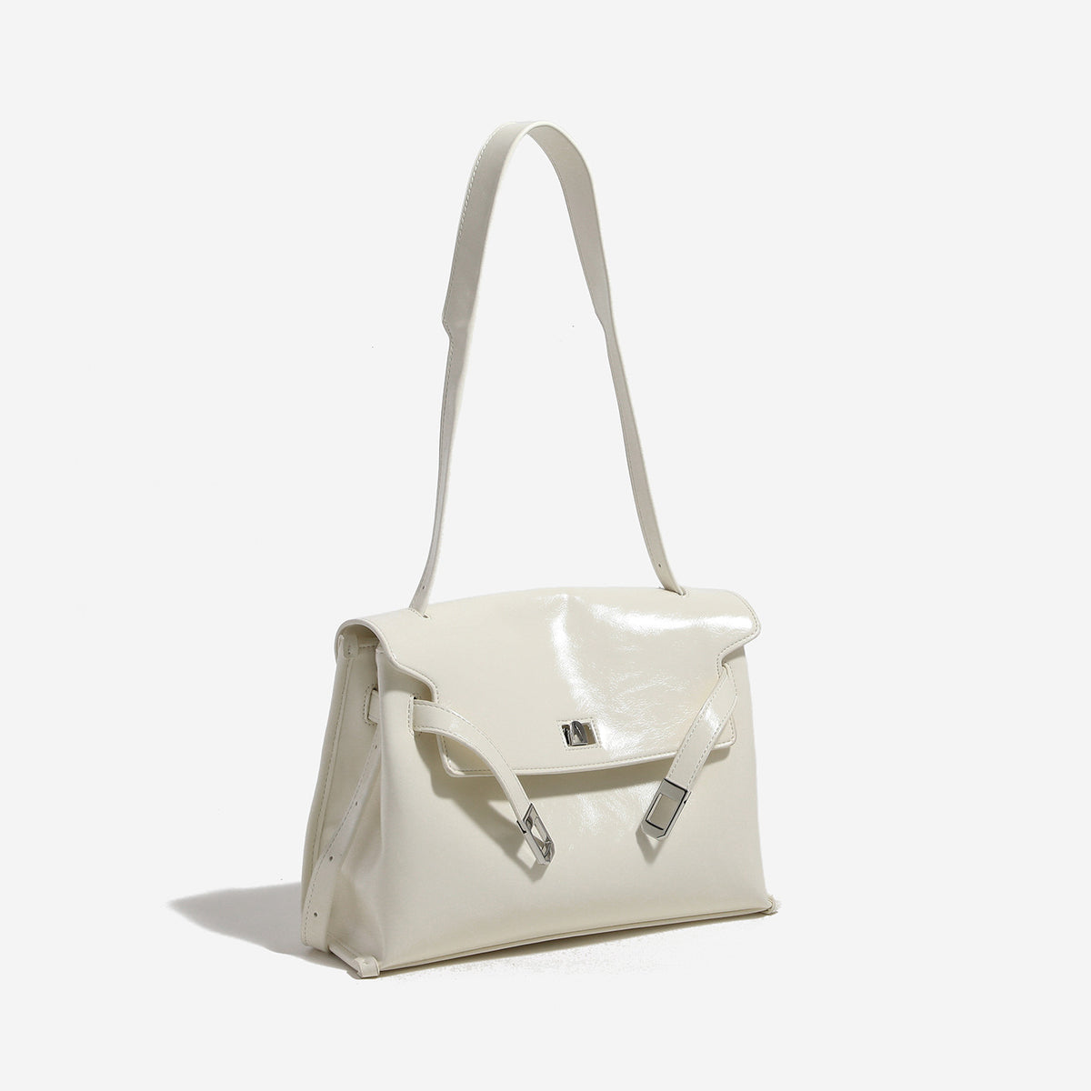 Structured rectangular flap shoulder bag in glossy leather-look finish with silver-tone turn-lock closure and adjustable