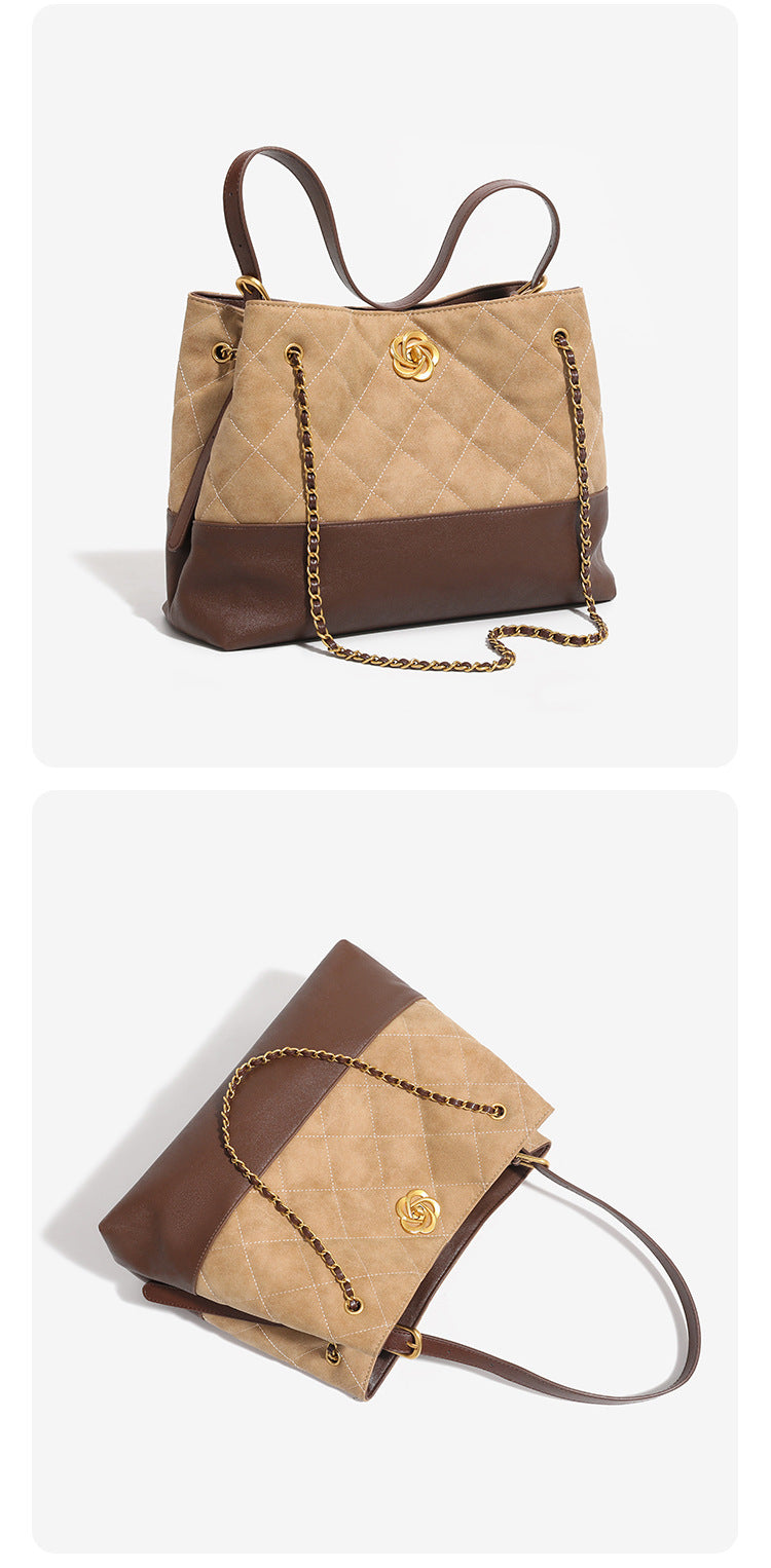 Two-tone tan quilted and dark brown leather-look tote bag with gold chain strap and floral knot emblem, detail view 8