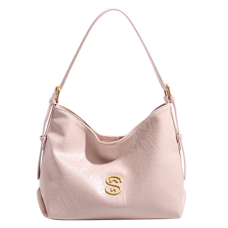 Crinkled leather-look hobo shoulder bag with gold-tone logo emblem and slim adjustable strap, detail view 5