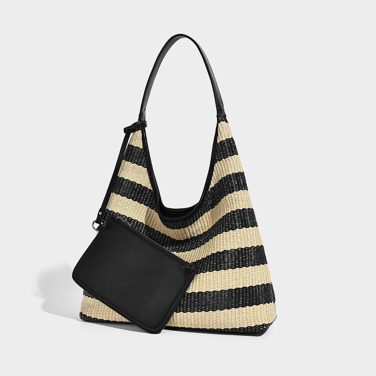 Black and beige striped woven shoulder tote bag with leather-look trim and detachable black zip pouch, front view