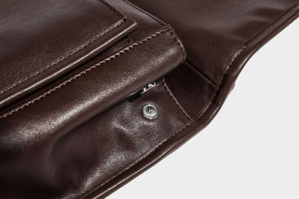 Structured rectangular satchel bag in dark espresso brown with smooth leather-look finish, flap front with silver turn-lock