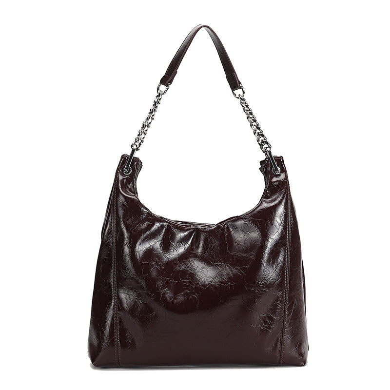 Glossy crinkled leather-look slouchy hobo bag with silver chain-and-leather shoulder strap and open top, detail view 5