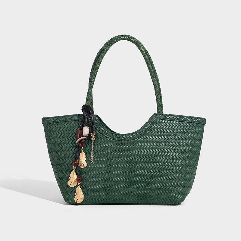 Large open-top woven tote bag with contrasting braided double handles and matching drawstring pouch, detail view 10