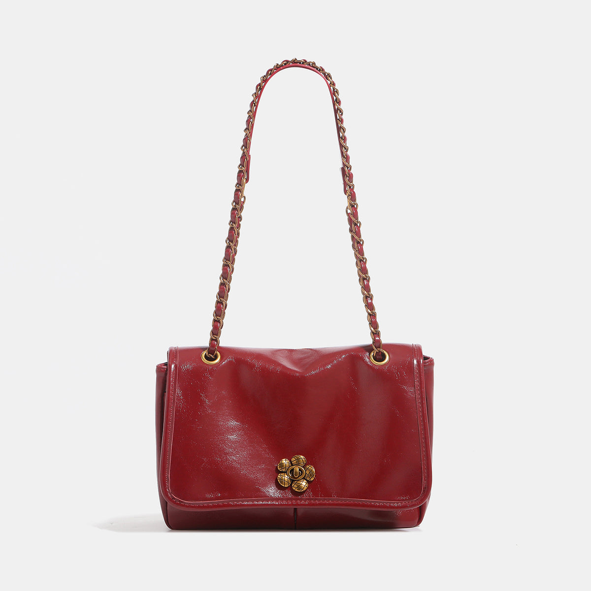 Structured glossy flap shoulder bag with antique gold floral turn-lock clasp and chain-and-leather strap, detail view 9