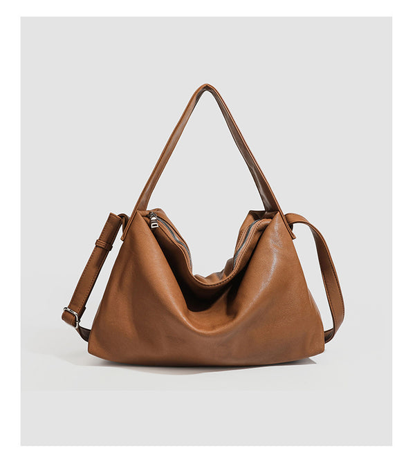 Slouchy leather-look hobo shoulder bag with top zipper and silver-tone hardware, detail view 21