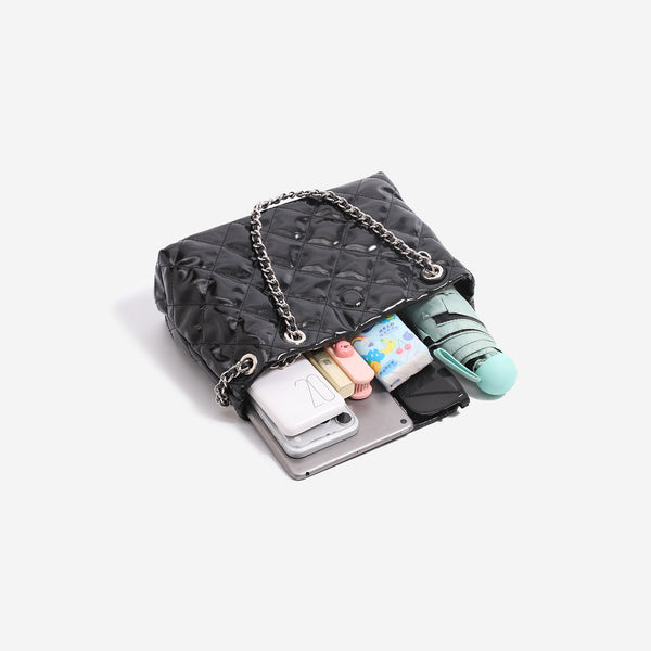 Structured diamond-quilted glossy black shoulder tote bag with interwoven silver chain strap and front flap snap pocket