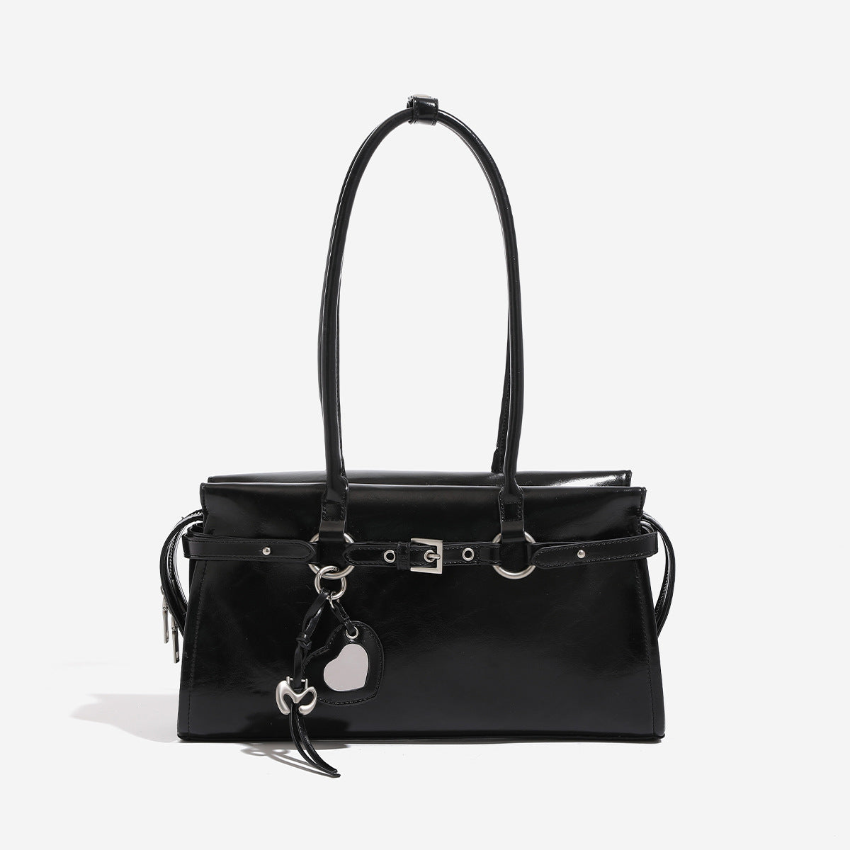 Glossy structured rectangular shoulder bag with twin straps, belt buckle front strap, heart charm pendant, and silver-tone