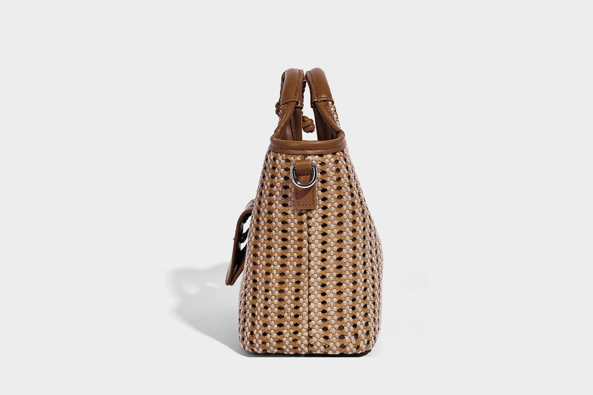 Small structured woven tote crossbody bag with ring top handle, leather-look brown trim, front patch pocket, and detachable