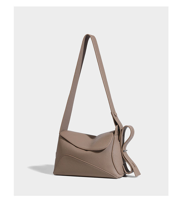 Structured curved-flap pebbled PU shoulder bag with sculptural loop strap detail, detail view 11