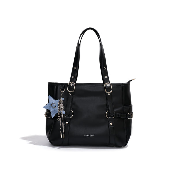 Large structured black leather-look tote bag with zip top, silver-tone hardware, side buckle straps, and detachable denim