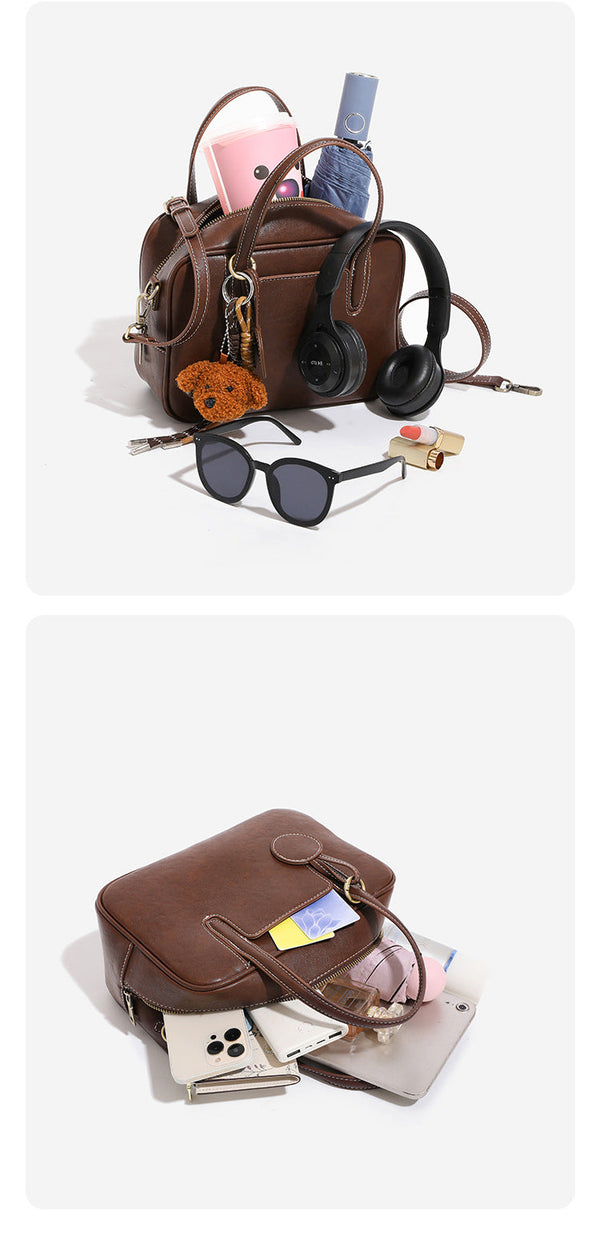 Structured boxy bowling-style tote bag in deep brown leather-look finish with dual top handles, front slip pocket, round
