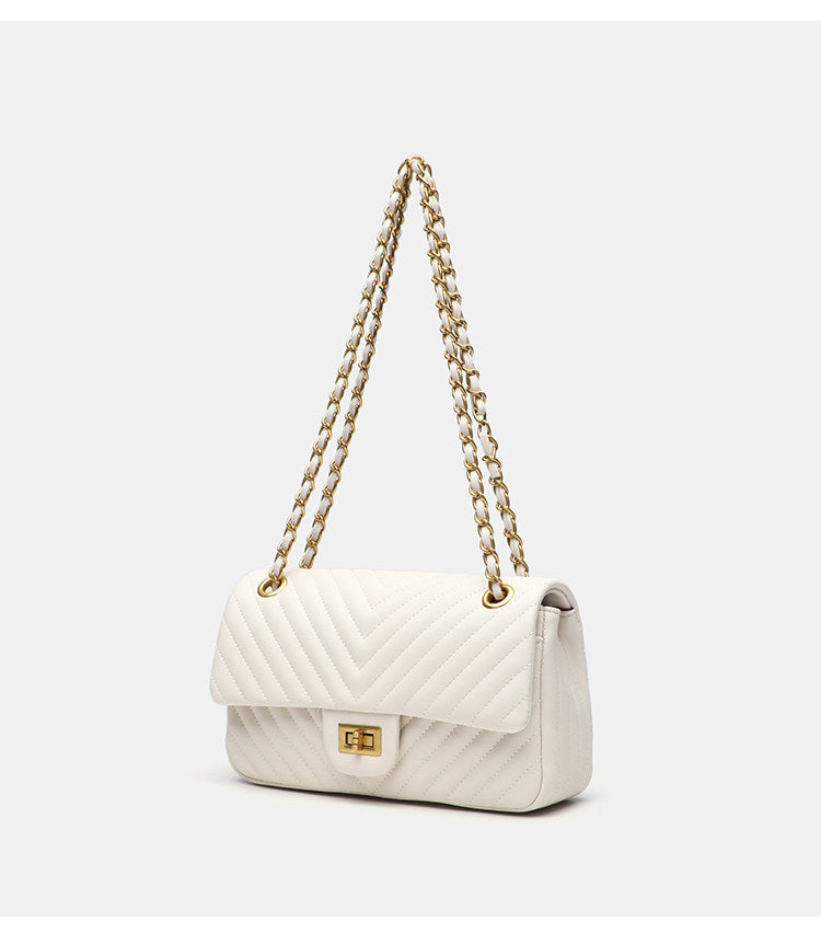Structured quilted flap bag with gold-tone chain strap and turn-lock closure, detail view 6