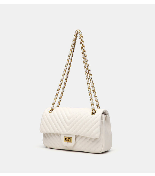Structured quilted flap bag with gold-tone chain strap and turn-lock closure, detail view 6
