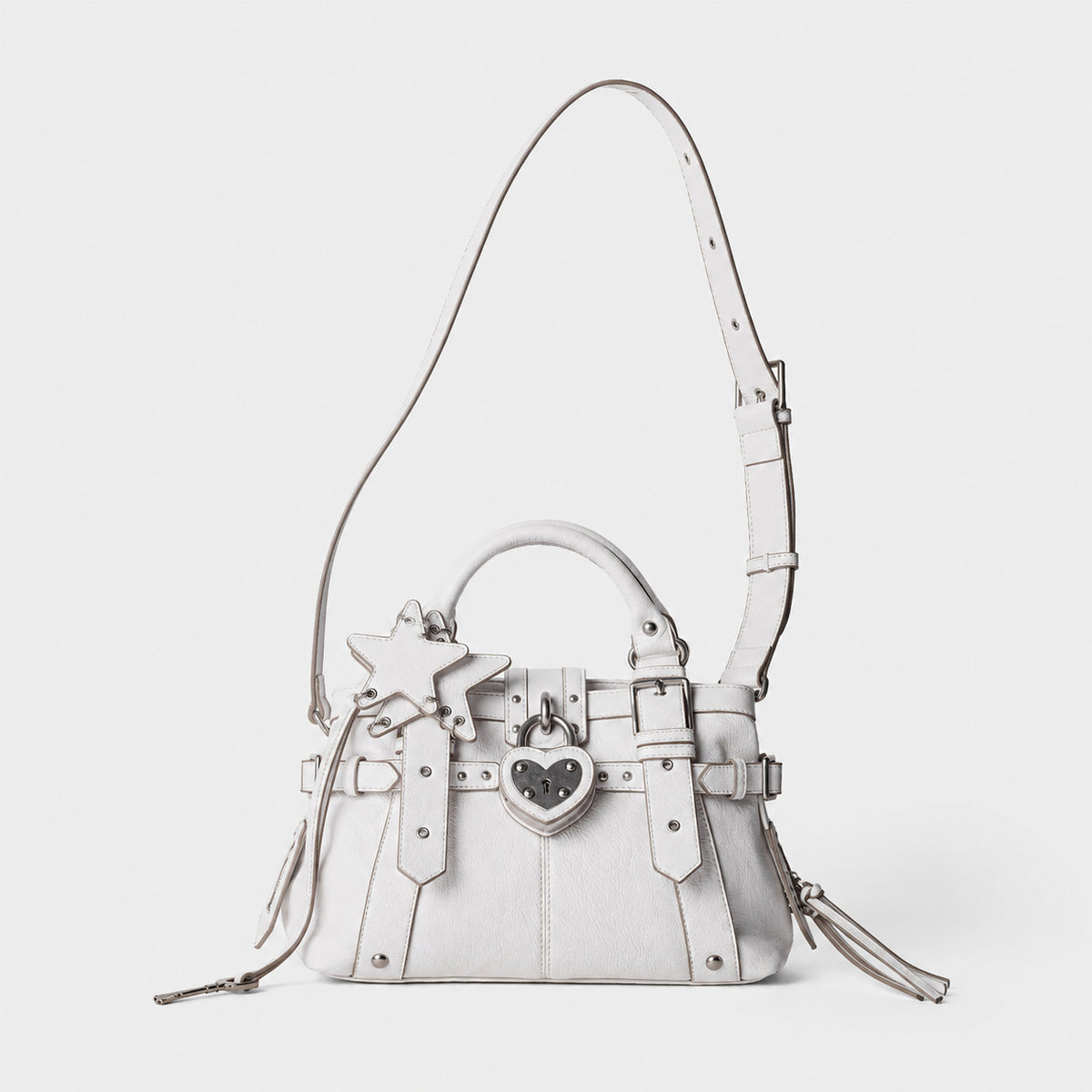 Structured satchel bag with heart-shaped padlock hardware, rivet studs, star charm, and twin top handles, detail view 15