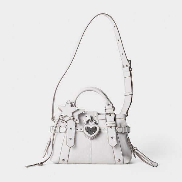 Structured satchel bag with heart-shaped padlock hardware, rivet studs, star charm, and twin top handles, detail view 15