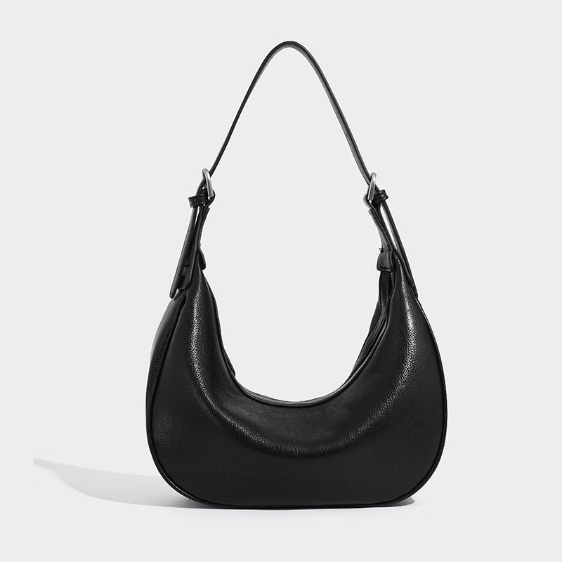 Crescent half-moon shoulder bag in pebbled leather-look finish with adjustable strap and silver-tone hardware, detail view 3