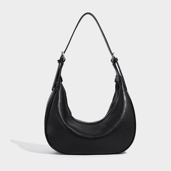 Crescent half-moon shoulder bag in pebbled leather-look finish with adjustable strap and silver-tone hardware, detail view 3