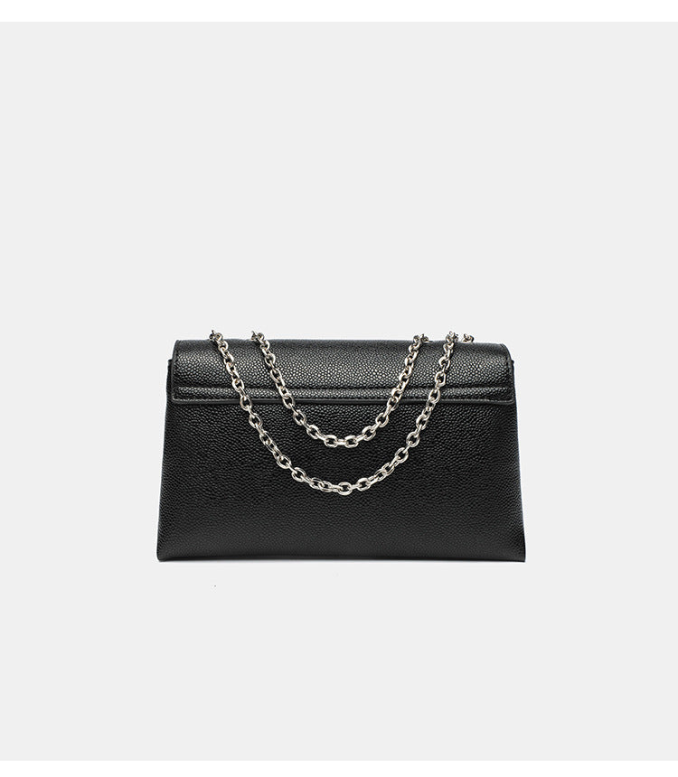 Structured rectangular flap crossbody bag with rhinestone bow and silver chain strap in pebbled finish, detail view 12