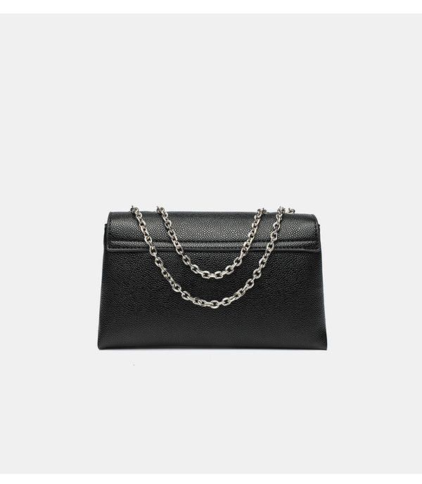 Structured rectangular flap crossbody bag with rhinestone bow and silver chain strap in pebbled finish, detail view 12