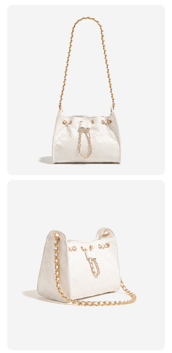 Glossy diamond-quilted drawstring bucket bag with gold-tone chain strap and eyelet hardware, detail view 14
