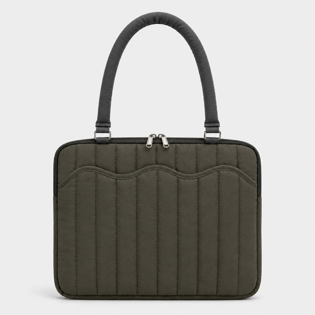 Quilted colorblock handbag with wavy scalloped front panel, padded arched top handles, and dual zip closure, detail view 10