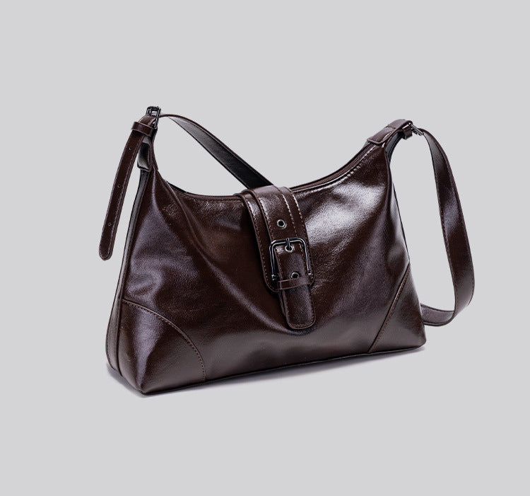 Glossy dark brown slouch hobo shoulder bag with front buckle strap panel and long adjustable single strap, detail view 14
