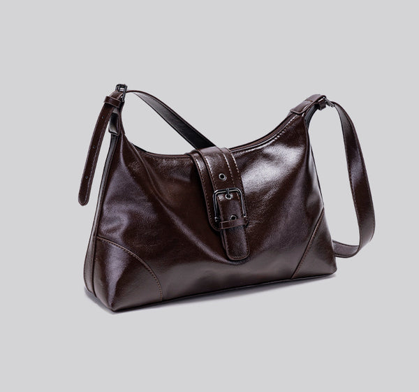 Glossy dark brown slouch hobo shoulder bag with front buckle strap panel and long adjustable single strap, detail view 14