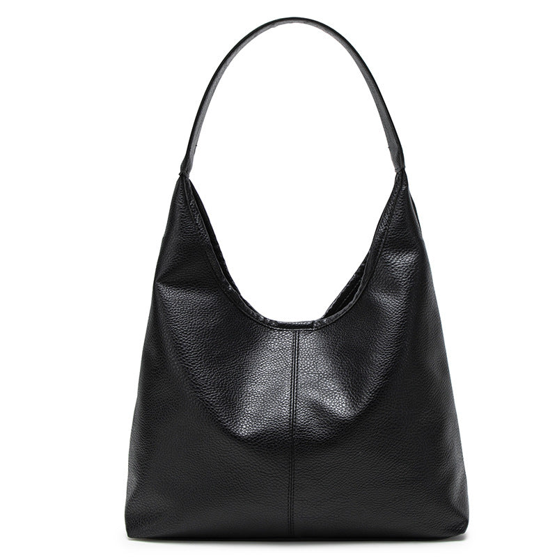 Large slouchy hobo shoulder bag in pebbled matte leather-look finish with single flat strap, detail view 5