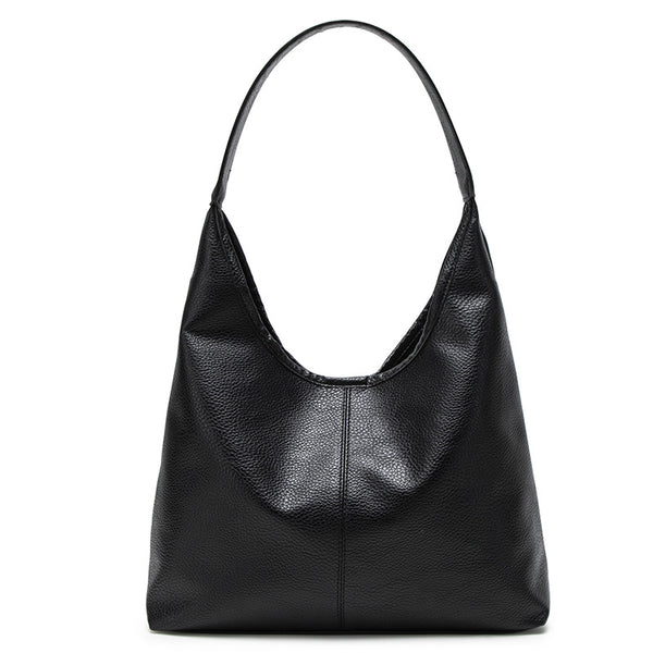 Large slouchy hobo shoulder bag in pebbled matte leather-look finish with single flat strap, detail view 5