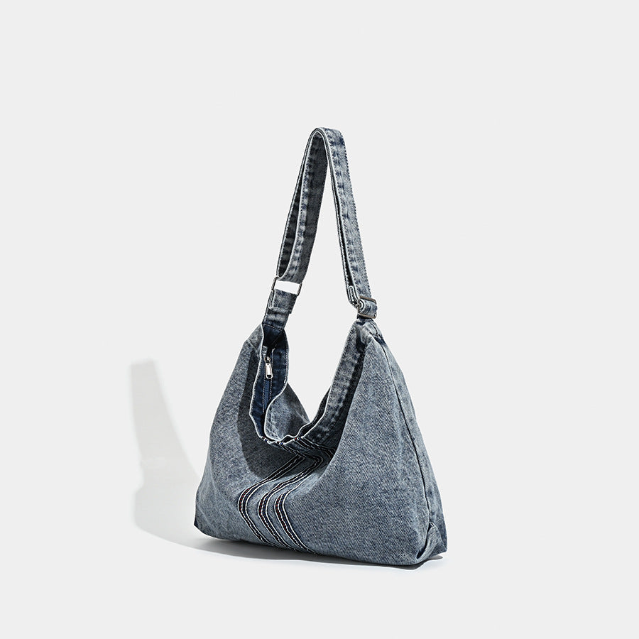 Oversized washed denim hobo shoulder bag with contrast stripe stitching and wide adjustable strap, detail view 3