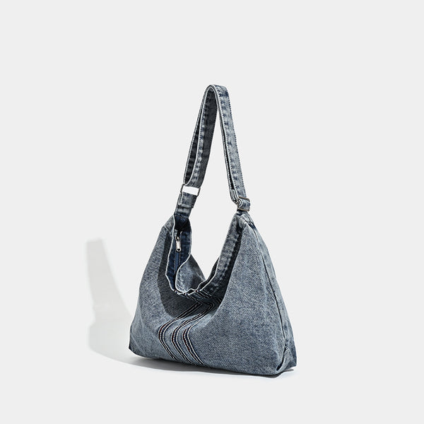 Oversized washed denim hobo shoulder bag with contrast stripe stitching and wide adjustable strap, detail view 3