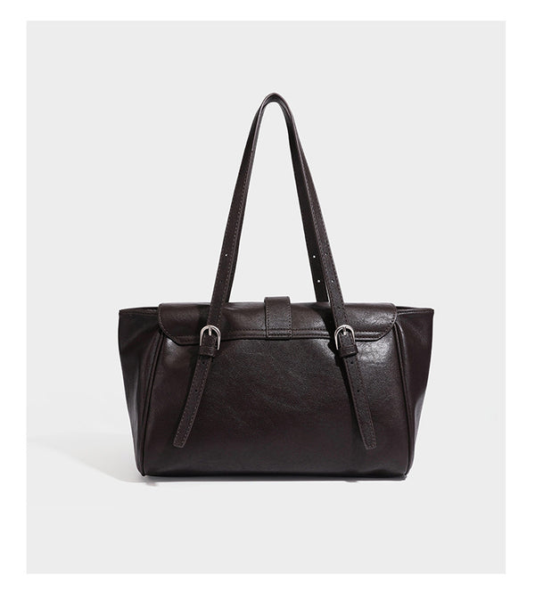 Large structured vintage-style tote bag with flap-front turn-lock closure, twin buckle straps, and double shoulder handles