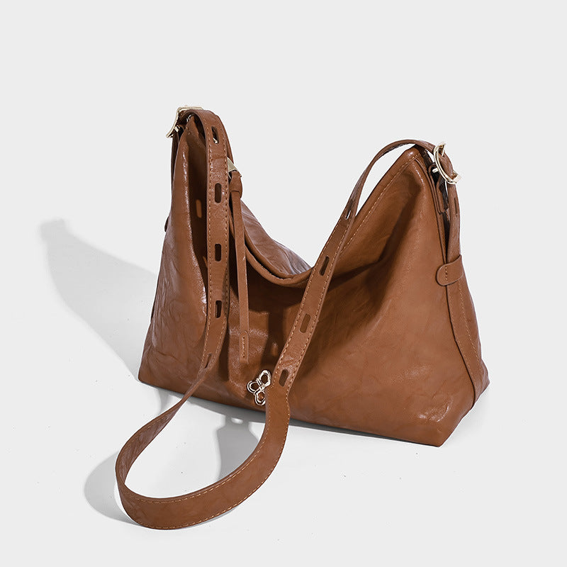 Slouchy leather-look hobo shoulder bag with gold-tone hardware and adjustable strap in brown, detail view 24
