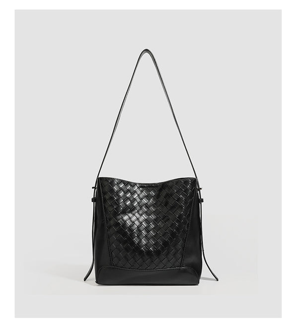 Large black bucket shoulder bag with diamond woven leather-look front panel, smooth side panels, magnetic snap closure, and