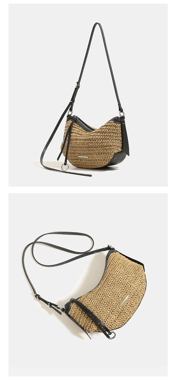Compact crescent-shaped woven straw crossbody bag with black leather-look trim, top zip closure, and adjustable shoulder