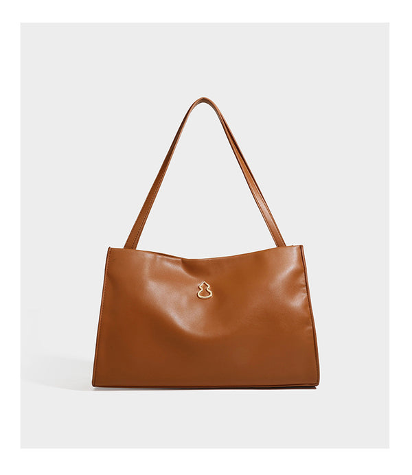 Structured rectangular shoulder tote bag with smooth leather-look finish, long double straps, and gold-tone gourd emblem on