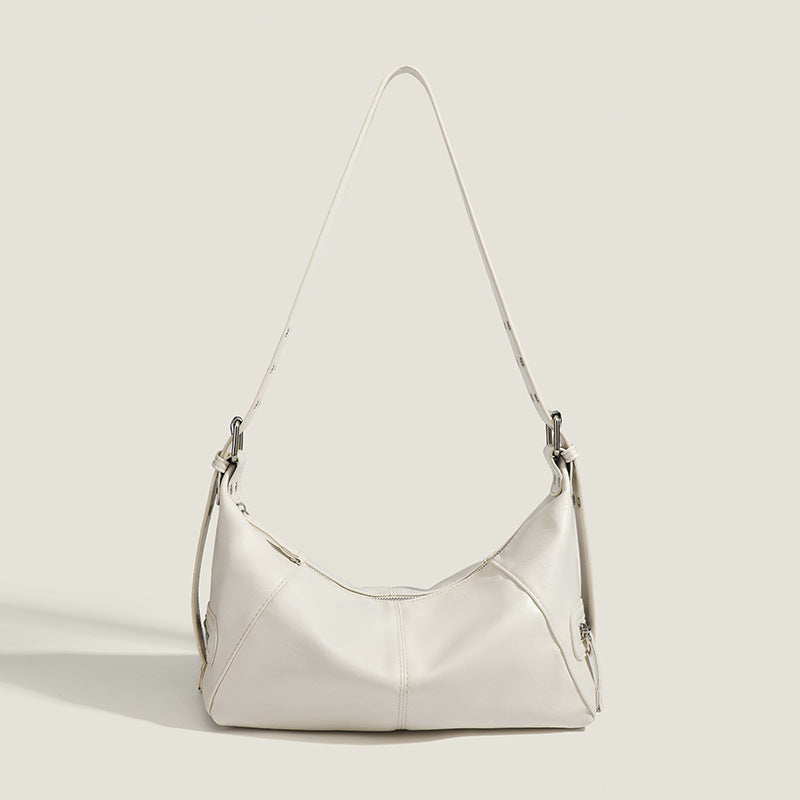 Glossy crinkled mini hobo shoulder bag with studded adjustable strap and silver-tone hardware, detail view 9