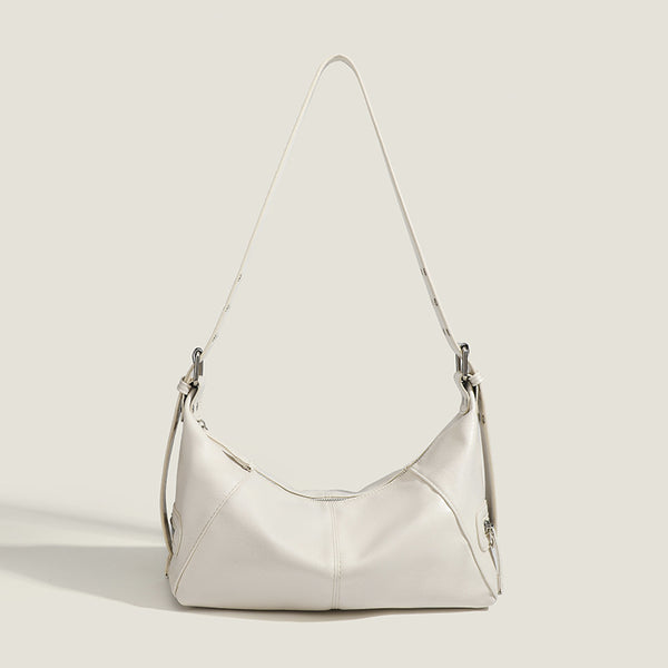 Glossy crinkled mini hobo shoulder bag with studded adjustable strap and silver-tone hardware, detail view 9