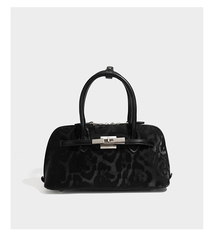 Strukturierte Henkeltasche mit tonal abgestimmtem Leopardenprint, Besatz in Lederoptik, gerollten Henkeln, vorderem Drehverschluss und