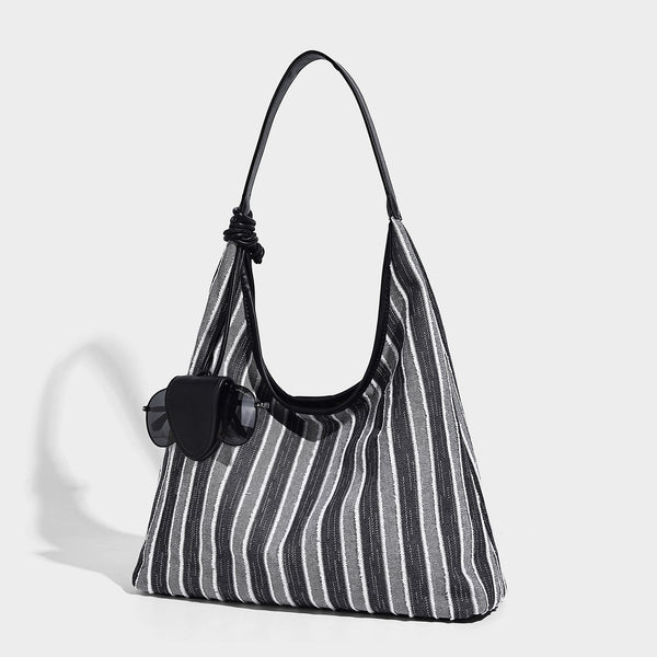 Slouchy striped canvas hobo shoulder bag with cream trim and long knotted strap, detail view 3