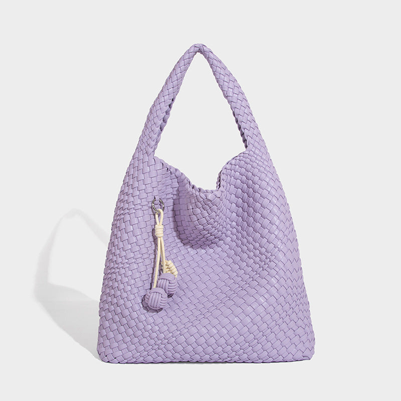 Soft hand-woven slouchy hobo tote bag with knotted tassel charm and single looped shoulder strap, detail view 19