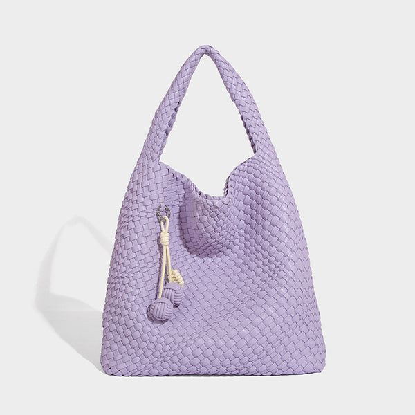 Soft hand-woven slouchy hobo tote bag with knotted tassel charm and single looped shoulder strap, detail view 19